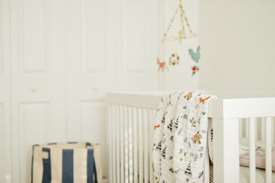Quilt Blanket draped on a cot in a nursery