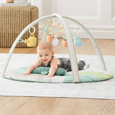 Baby on an Activity Toy Bar & Mat