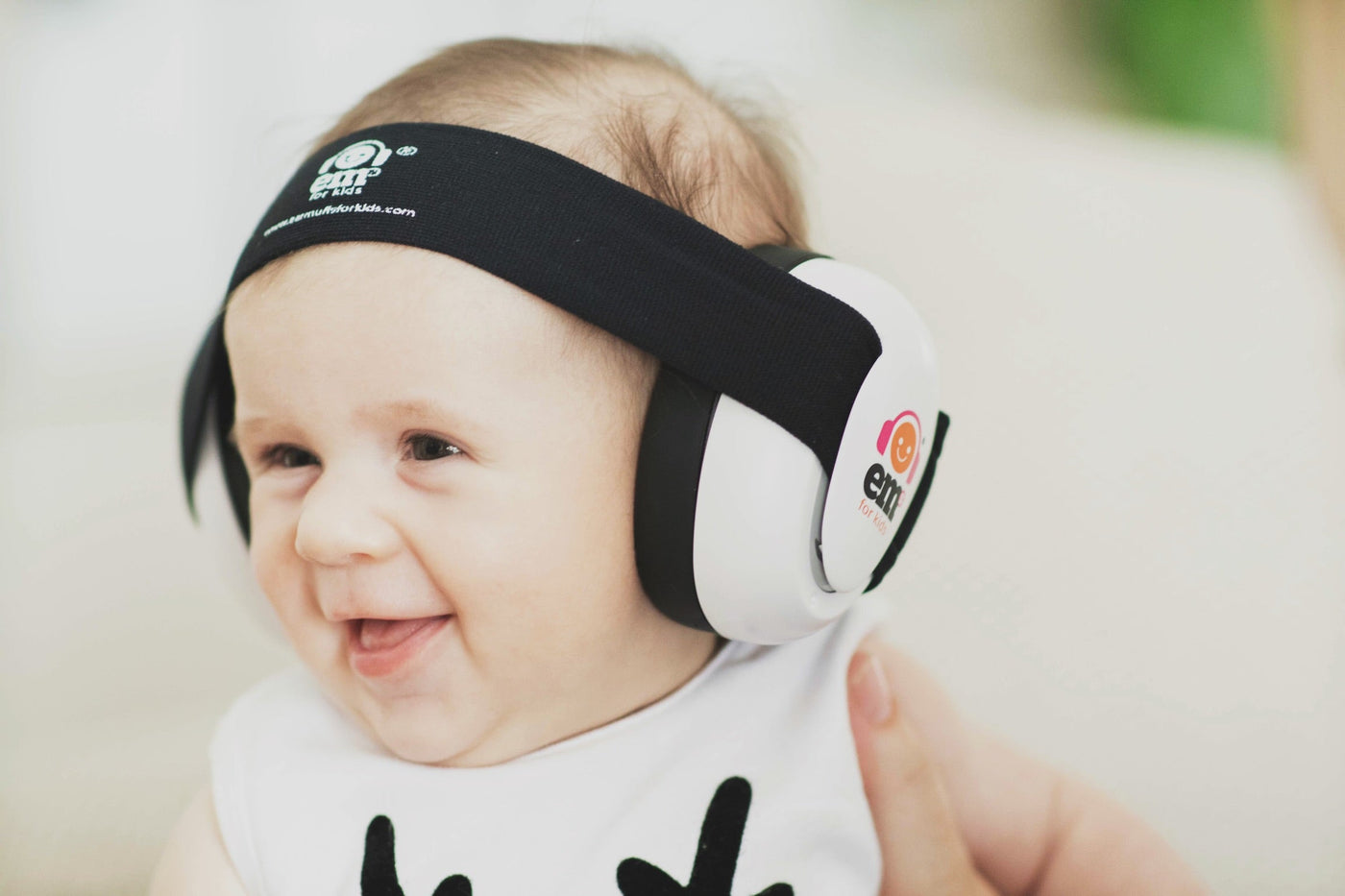 Baby with Ems for Kids ear muffs on