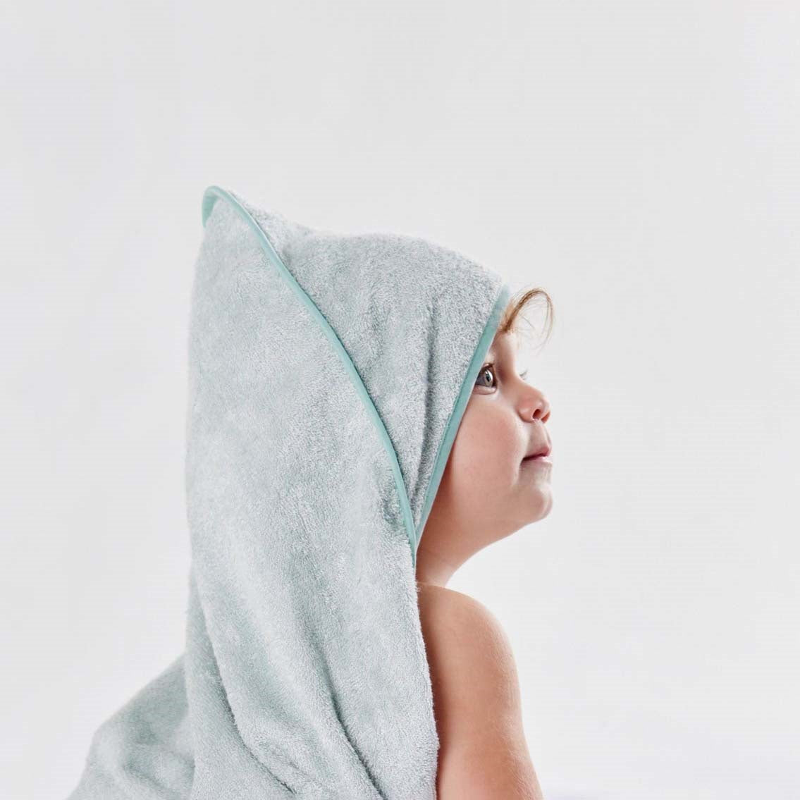 Toddler wearing a Little Bamboo hooded towel 