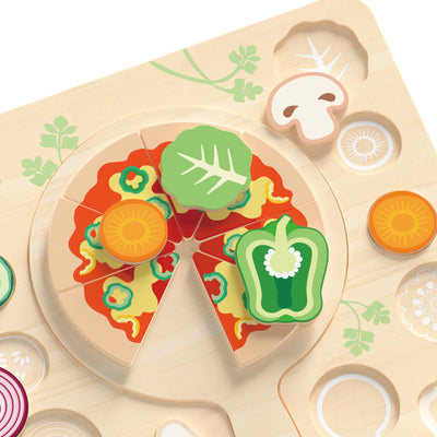 Wooden toy pizza with colorful vegetable pieces on a light brown tray