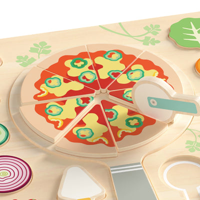 Wooden pizza toy with colorful slices and a pizza cutter on a beige surface.